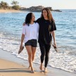 two sisters walking along the beach
