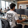 Guy_wearing_T-shirt_office